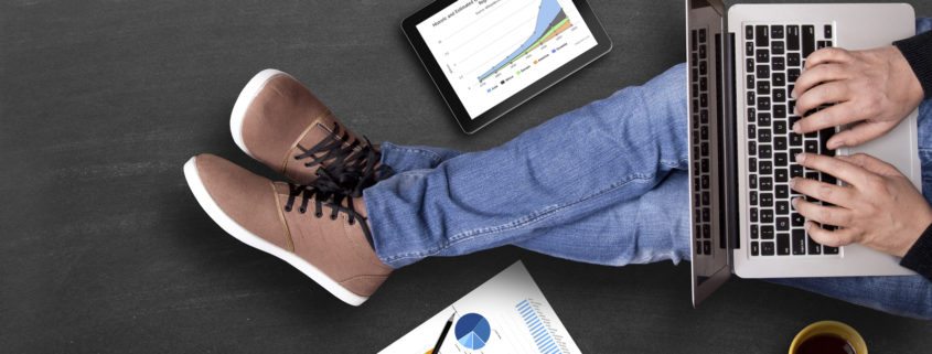 Global business growth graph analyzing with laptop